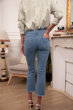 Jean flare mi-long à frange